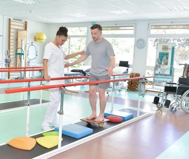 Patient practising balance on a training pad